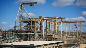 Aerial view of a Ravenwood Gold Mine in Queensland Australia showing a gold processing plant structure under a blue sky