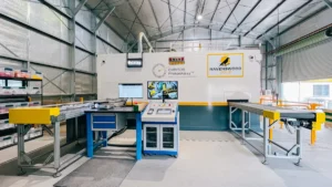 Interior of the Ravenswood Gold Mine PhotonAssay™ facility showing the installed unit and yellow conveyor infrastructure