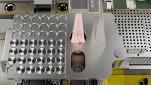 Close-up of the interior of a PhotonAssay™ unit showing the sample carousel, irradiation chamber, and detection components