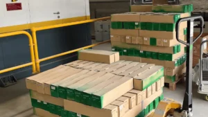 Pallets of boxed equipment containing parts of the PhotonAssay™ 1408X system arriving at a mine site ready for installation