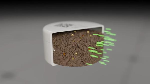 Illustration of a PhotonAssay™ sample jar containing crushed ore being penetrated by high-energy X-rays, visualising the gamma activation analysis process