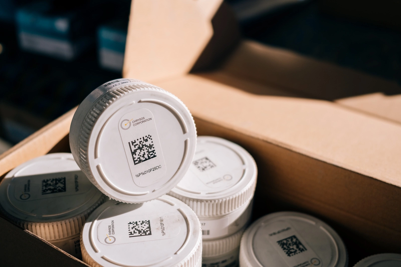 Chrysos Corporation PhotonAssay™ sample jars with QR-coded lids for gold analysis tracking